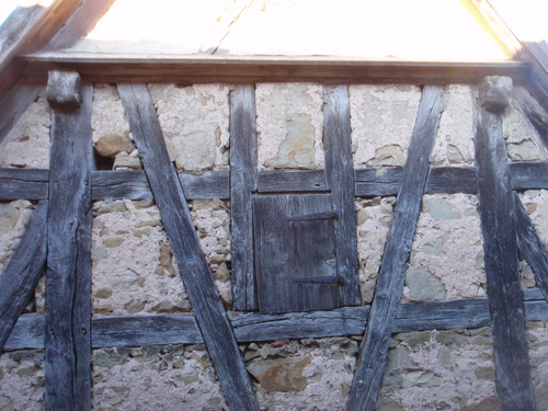 Close up of old barn's hay bale door opening.